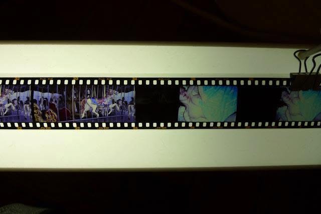Sluice Art Fair — a 35mm film strip and carousel frames clamped over a light box